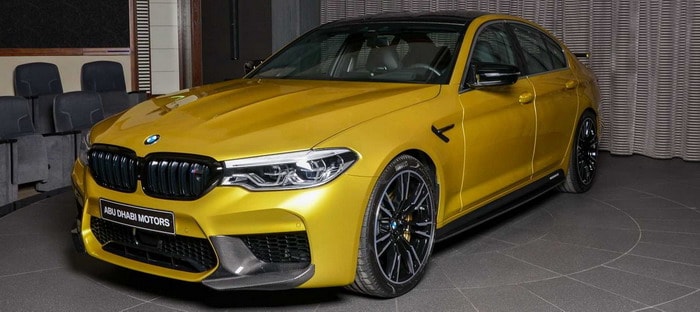 BMW M5 Competition Austin Yellow سيارة فائقة بلون مثير في أبوظبي